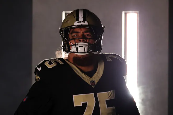NEW ORLEANS, LOUISIANA - OCTOBER 12: Taliese Fuaga #75 of the New Orleans Saints takes on the field in the game against the New England Patriots at Caesars Superdome on October 12, 2025 in New Orleans, Louisiana. (Photo by Stacy Revere/Getty Images)