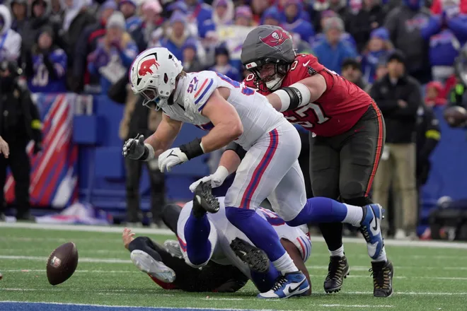 Buffalo Bills defensive end Joey Bosa tuns towards the fumble that Buffalo Bills defensive tackle DaQuan Jones caused after sacking Tampa Bay Buccaneers quarterback Baker Mayfield during second half action against the Tampa Bay Buccaneers on Nov 16, 2025 at Highmark Stadium in Orchard Park. The Bills recovered theh fumble.