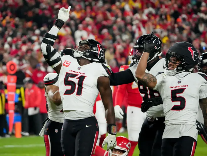 Dec 7, 2025; Kansas City, Missouri, USA; Houston Texans defensive end Will Anderson Jr. (51) and Houston Texans safety Jalen Pitre (5) celebrate after sacking Kansas City Chiefs quarterback Patrick Mahomes (15) during the first quarter at GEHA Field at Arrowhead Stadium. Mandatory Credit: Denny Medley-Imagn Images