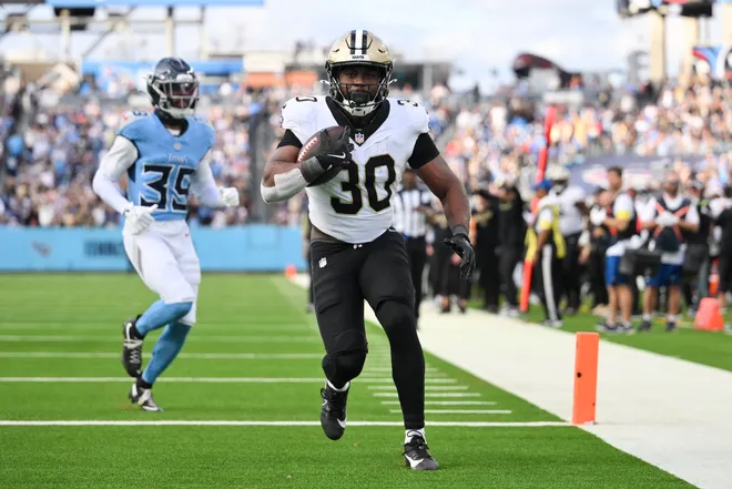 Dec 28, 2025; Nashville, Tennessee, USA; New Orleans Saints running back Audric Estime (30) runs for a touchdown against the Tennessee Titans during the second half of the game at Nissan Stadium. Mandatory Credit: Steve Roberts-Imagn Images