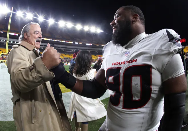 Jan 12, 2026; Pittsburgh, PA, USA; Houston Texans owner Cal McNair greets defensive tackle Sheldon Rankins (90) after an AFC Wild Card Round game against the Pittsburgh Steelers at Acrisure Stadium. Mandatory Credit: Charles LeClaire-Imagn Images