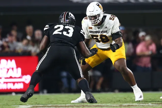 Sep 6, 2025; Starkville, Mississippi, USA; Arizona State Sun Devils offensive lineman Max Iheanachor (58) blocks Mississippi State Bulldogs defensive lineman Trevion Williams (23) during the third quarter at Davis Wade Stadium at Scott Field. Mandatory Credit: Petre Thomas-Imagn Images