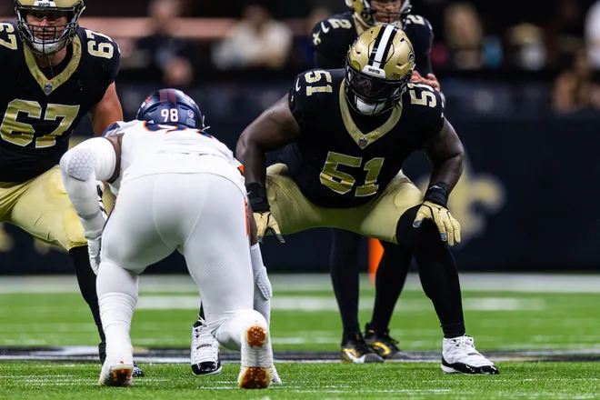 Aug 23, 2025; New Orleans, Louisiana, USA; New Orleans Saints center Cesar Ruiz (51) blocks Denver Broncos defensive end John Franklin-Myers (98) during the first half at Caesars Superdome. Mandatory Credit: Stephen Lew-Imagn Images