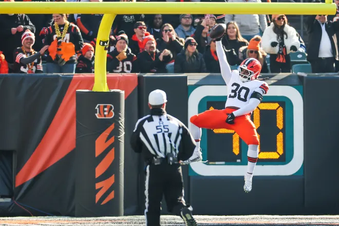 Jan 4, 2026; Cincinnati, Ohio, USA; Cleveland Browns linebacker Devin Bush (30) celebrates after returning an interception for a touchdown against the Cincinnati Bengals during the first quarter at Paycor Stadium. Mandatory Credit: Joseph Maiorana-Imagn Images