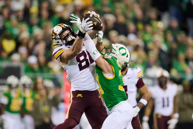 Nov 14, 2025; Eugene, Oregon, USA; Oregon Ducks defensive back Dillon Thieneman (31) breaks up a pass play intended for Minnesota Golden Gophers tight end Jameson Geers (86) during the first half at Autzen Stadium. Mandatory Credit: Troy Wayrynen-Imagn Images