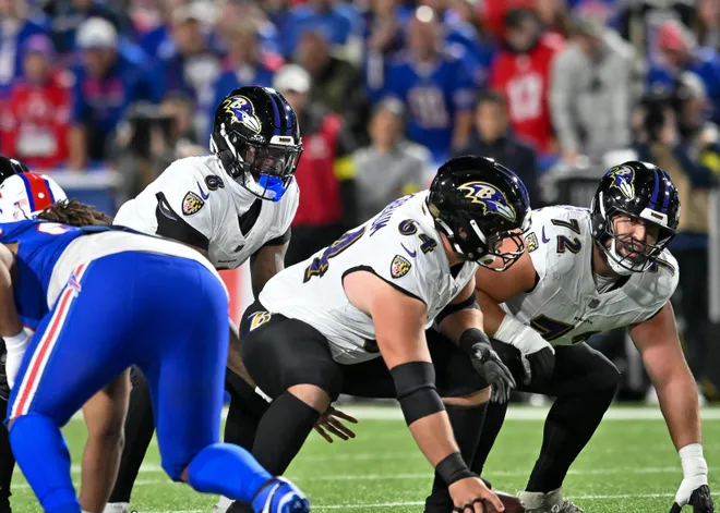 Sep 7, 2025; Orchard Park, New York, USA; Baltimore Ravens quarterback Lamar Jackson (8) with center Tyler Linderbaum (64) and guard Andrew Vorhees (72) at the line of scrimmage in the first quarter against the Buffalo Bills at Highmark Stadium. Mandatory Credit: Mark Konezny-Imagn Images