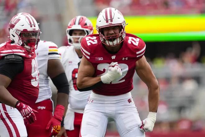 Sep 20, 2025; Madison, Wisconsin, USA; Wisconsin Badgers linebacker Mason Reiger (22) reacts following a tackle during the third quarter against the Maryland Terrapins at Camp Randall Stadium. Mandatory Credit: Jeff Hanisch-Imagn Images