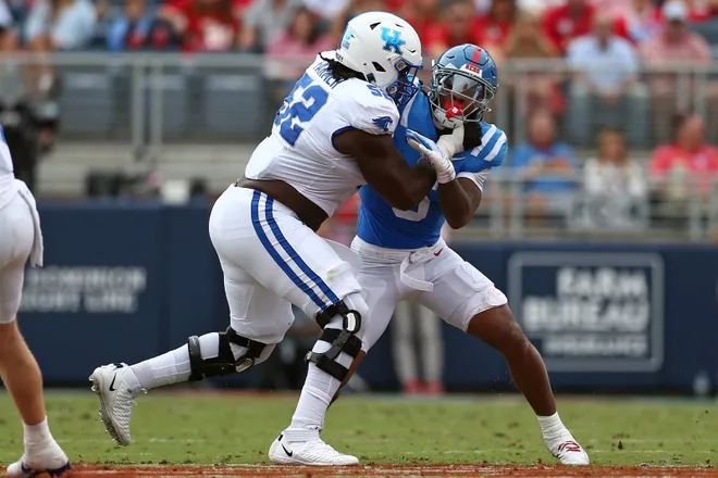 Sep 28, 2024; Oxford, Mississippi, USA; Kentucky Wildcats offensive lineman Jalen Farmer (52) blocks Mississippi Rebels linebacker TJ Dottery (6) during the first half at Vaught-Hemingway Stadium. Mandatory Credit: Petre Thomas-Imagn Images