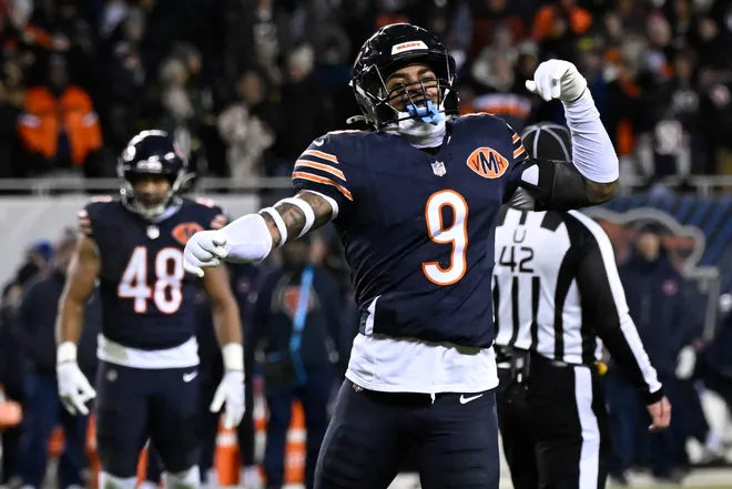 Jan 10, 2026; Chicago, IL, USA; Chicago Bears safety Jaquan Brisker (9) fires up the crowd after a penalty call against the Green Bay Packers during the second half of an NFC Wild Card Round game at Soldier Field. Mandatory Credit: Matt Marton-Imagn Images