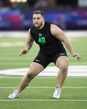INDIANAPOLIS, INDIANA - MARCH 01: Beau Stephens of the Iowa Hawkeyes participates in a drill during the 2026 NFL Scouting Combine at Lucas Oil Stadium on March 01, 2026 in Indianapolis, Indiana. (Photo by Stacy Revere/Getty Images)