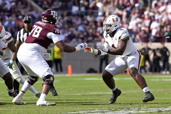 Dec 20, 2025; College Station, TX, USA; Texas A&M Aggies offensive lineman Dametrious Crownover (78) blocks Miami Hurricanes defensive lineman Rueben Bain Jr. (4) during the game between the Aggies and the Hurricanes at Kyle Field. Mandatory Credit: Jerome Miron-Imagn Images