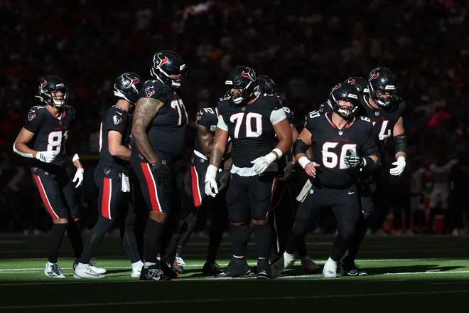 Nov 9, 2025; Houston, Texas, USA; Houston Texans center Juice Scruggs (70) and the offensive line break from a huddle against the Jacksonville Jaguars in the fourth quarter at NRG Stadium. Mandatory Credit: Thomas Shea-Imagn Images