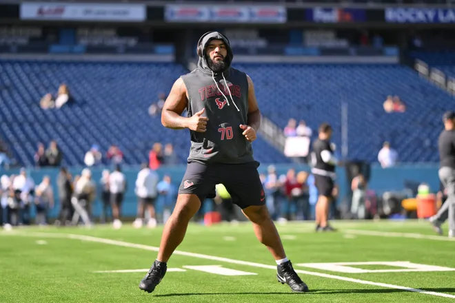 Nov 16, 2025; Nashville, Tennessee, USA; Houston Texans center Juice Scruggs (70) warms up before the game between the Houston Texans and Tennessee Titans at Nissan Stadium. Mandatory Credit: Steve Roberts-Imagn Images