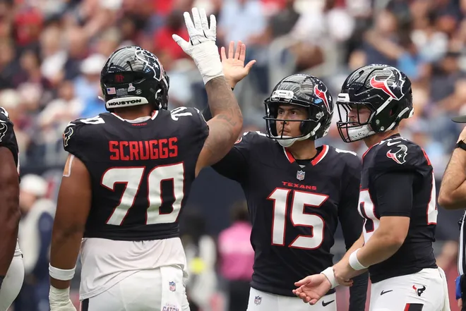 Sep 28, 2025; Houston, Texas, USA; Houston Texans kicker Ka'Imi Fairbairn (15) celebrates with center Juice Scruggs (70) after making a field goal during the first quarter against the Tennessee Titans at NRG Stadium. Mandatory Credit: Troy Taormina-Imagn Images
