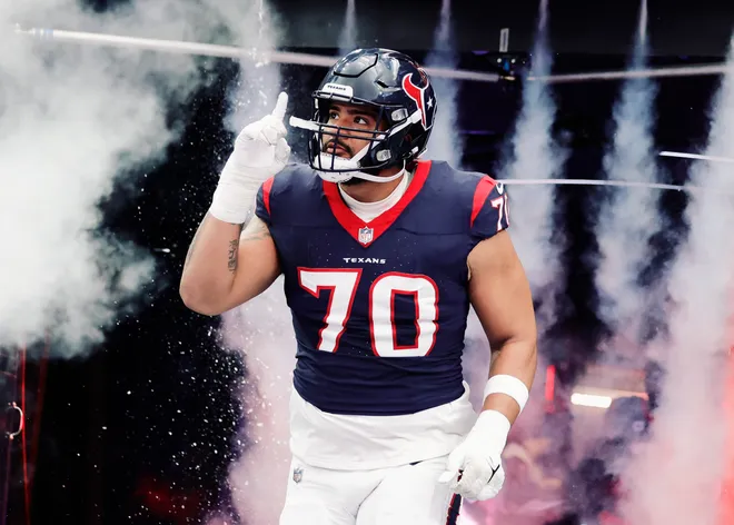 HOUSTON, TEXAS - DECEMBER 31: Juice Scruggs #70 of the Houston Texans takes the field at NRG Stadium on December 31, 2023 in Houston, Texas. (Photo by Carmen Mandato/Getty Images)