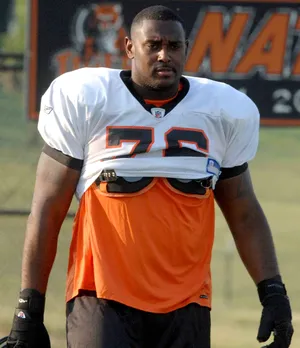 Cincinnati Bengals offensive tackle Levi Jones walk down the field.