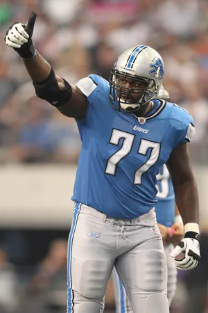 Detroit Lions tackle Gosder Cherlius reacts during the game against the Dallas Cowboys at Cowboys Stadium.