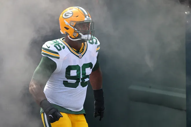 GREEN BAY, WISCONSIN - AUGUST 24: Colby Wooden #96 of the Green Bay Packers takes the field prior to a preseason game against the Baltimore Ravens at Lambeau Field on August 24, 2024 in Green Bay, Wisconsin. The Packers defeated the Ravens 30-7. (Photo by Stacy Revere/Getty Images)