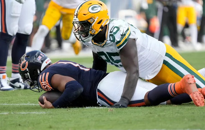 Sep 10, 2023; Chicago, Illinois, USA; Green Bay Packers defensive tackle Colby Wooden (96) sacks Chicago Bears quarterback Justin Fields (1) during the second half of their game at Soldier Field. Mandatory Credit: Mike De Sisti-USA TODAY Sports