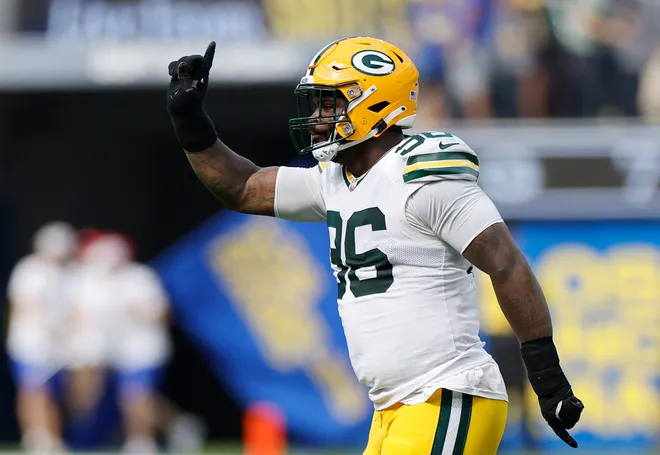 INGLEWOOD, CALIFORNIA - OCTOBER 06: Colby Wooden #96 of the Green Bay Packers celebrates a blocked PAT against the Los Angeles Rams during the second quarter at SoFi Stadium on October 06, 2024 in Inglewood, California. (Photo by Kevork Djansezian/Getty Images)
