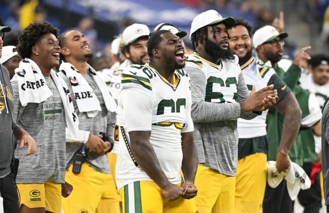 Aug 16, 2025; Indianapolis, Indiana, USA; Green Bay Packers defensive lineman Colby Wooden (96) celebrates after a touchdown during the second half agains the Indianapolis Colts at Lucas Oil Stadium. Mandatory Credit: Robert Goddin-Imagn Images