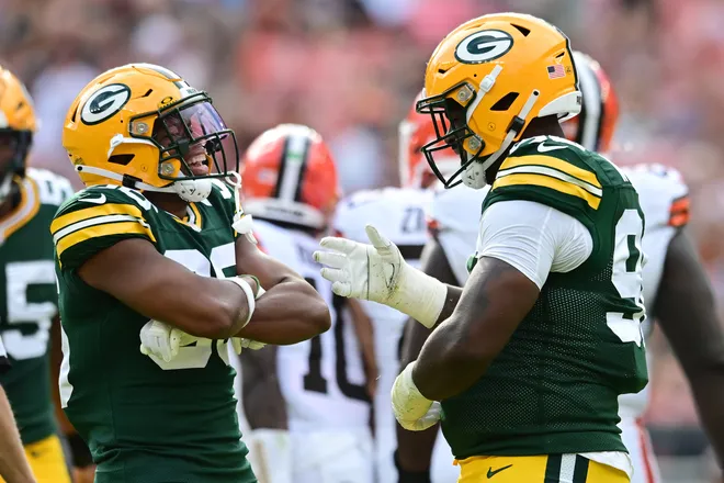 Aug 10, 2024; Cleveland, Ohio, USA; Green Bay Packers safety Anthony Johnson Jr. (36) and defensive tackle Colby Wooden (96) celebrate after a sack during the second quarter against the Cleveland Browns at Cleveland Browns Stadium. Mandatory Credit: Ken Blaze-USA TODAY Sports
