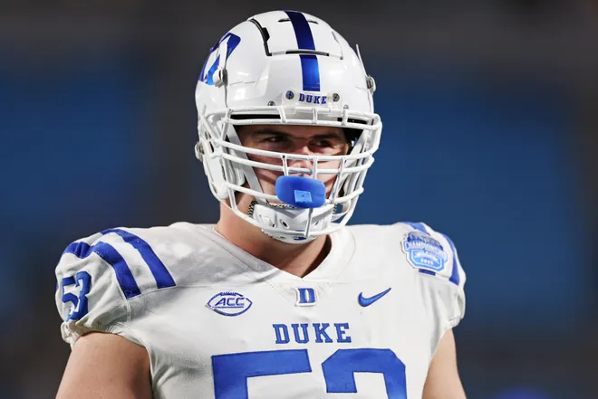 CHARLOTTE, NORTH CAROLINA - DECEMBER 06: Brian Parker II #53 of the Duke Blue Devils looks on before the 2025 ACC Football Championship against the Virginia Cavaliers at Bank of America Stadium on December 06, 2025 in Charlotte, North Carolina. (Photo by David Jensen/Getty Images)