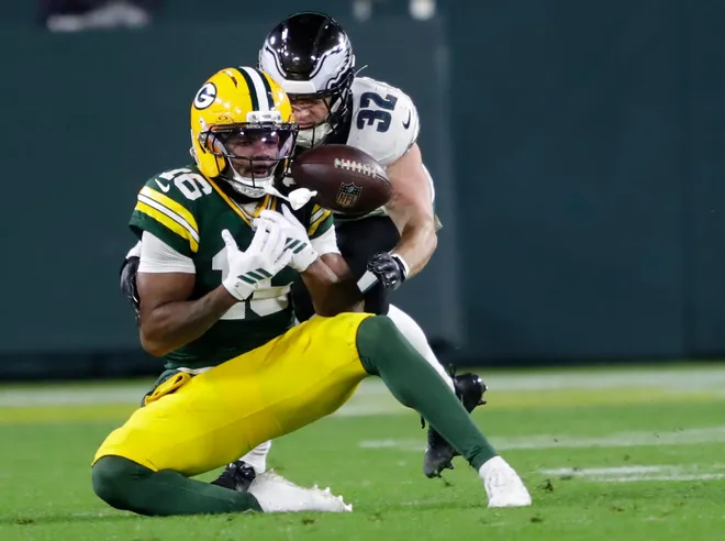 Green Bay Packers cornerback Bo Melton (16) drops a pass against Philadelphia Eagles safety Reed Blankenship (32) in the third quarter during their football game Monday, November 10, 2025, at Lambeau Field in Green Bay, Wisconsin. The Eagles took over on downs.