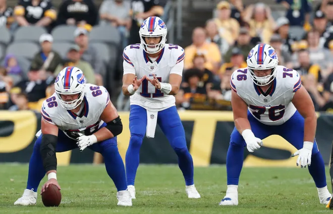 Aug 17, 2024; Pittsburgh, Pennsylvania, USA; Buffalo Bills center Connor McGovern (66) and quarterback Mitchell Trubisky (11) and guard David Edwards (76) at the line of scrimmage against the Pittsburgh Steelers during the first quarter at Acrisure Stadium. Mandatory Credit: Charles LeClaire-USA TODAY Sports