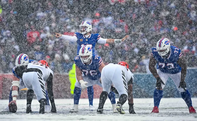 Dec 7, 2025; Orchard Park, New York, USA; Buffalo Bills quarterback Josh Allen (17) at the line of scrimmage with guard David Edwards (76) and offensive tackle Dion Dawkins (73) in the second quarter against the Cincinnati Bengals at Highmark Stadium. Mandatory Credit: Mark Konezny-Imagn Images