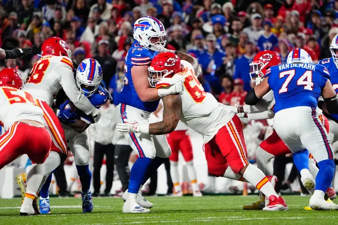 Nov 17, 2024; Orchard Park, New York, USA; Buffalo Bills guard David Edwards (76) blocks Kansas City Chiefs defensive tackle Mike Pennel Jr. (69) during the first half at Highmark Stadium. Mandatory Credit: Gregory Fisher-Imagn Images