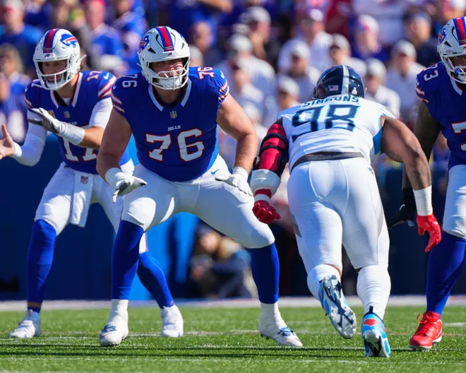 Oct 20, 2024; Orchard Park, New York, USA; Buffalo Bills guard David Edwards (76) looks to block Tennessee Titans defensive tackle Jeffrey Simmons (98) during the first half at Highmark Stadium. Mandatory Credit: Gregory Fisher-Imagn Images