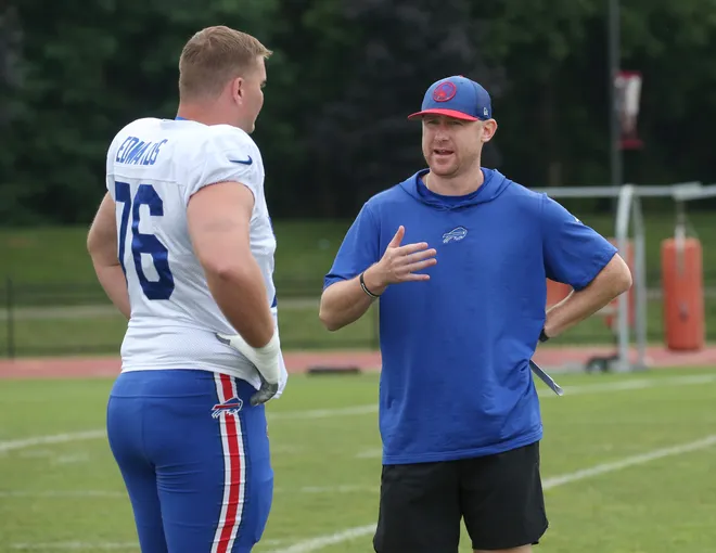 Buffalo Bills offensive coordinator Joe Brady talks with lineman David Edwards before the start of the Buffalo Bills training camp.