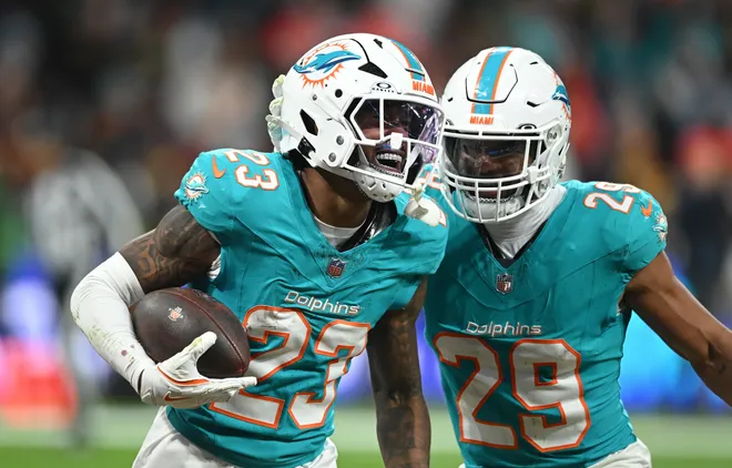 MADRID, SPAIN - NOVEMBER 16: Jack Jones (#23) celebrates winning possession of the ball with teammate Minkah Fitzpatrick during the NFL 2025 game between Washington Commanders and Miami Dolphins at Estadio Santiago Bernabeu on November 16, 2025 in Madrid, Spain. (Photo by Denis Doyle/Getty Images)