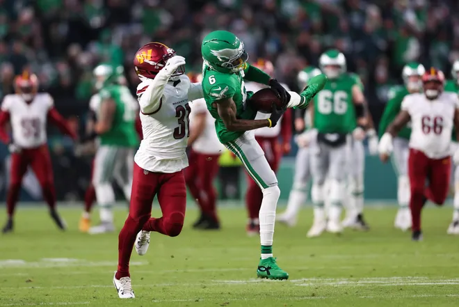 Jan 4, 2026; Philadelphia, Pennsylvania, USA; Philadelphia Eagles wide receiver Devonta Smith (6) makes a catch as Washington Commanders cornerback Jonathan Jones (31) defends during the second quarter at Lincoln Financial Field. Mandatory Credit: Bill Streicher-Imagn Images
