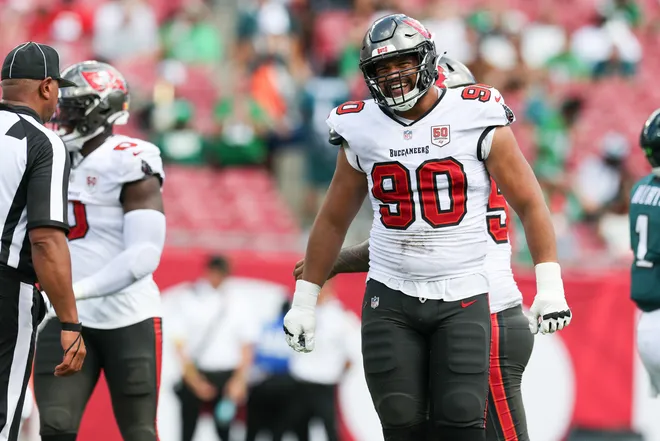 Sep 28, 2025; Tampa, Florida, USA; Tampa Bay Buccaneers defensive end Logan Hall (90) reacts after a play during the third quarter against the Philadelphia Eagles at Raymond James Stadium. Mandatory Credit: Nathan Ray Seebeck-Imagn Images