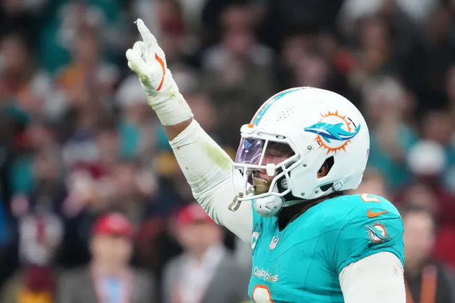 Nov 16, 2025; Madrid, Spain; Miami Dolphins linebacker Bradley Chubb (2) reacts after a play against the Washington Commanders in the fourth quarter during the 2025 NFL Madrid Game at Santiago Bernabeu Stadium. Mandatory Credit: Kirby Lee-Imagn Images
