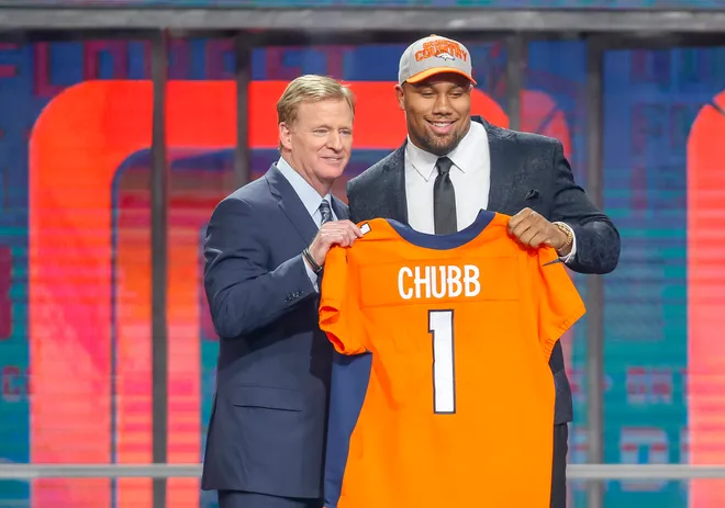 Apr 26, 2018; Arlington, TX, USA; Bradley Chubb (North Carolina State) poses with NFL commissioner Roger Goodell after being selected as the number five overall pick to the Denver Broncos in the first round of the 2018 NFL Draft at AT&T Stadium. Mandatory Credit: Tim Heitman-USA TODAY Sports