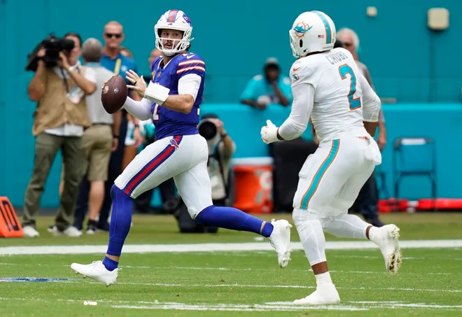 Nov 9, 2025; Miami Gardens, Florida, USA; Buffalo Bills quarterback Josh Allen (17) scrambles against Miami Dolphins linebacker Bradley Chubb (2) during the first half at Hard Rock Stadium. Mandatory Credit: Jeff Romance-Imagn Images