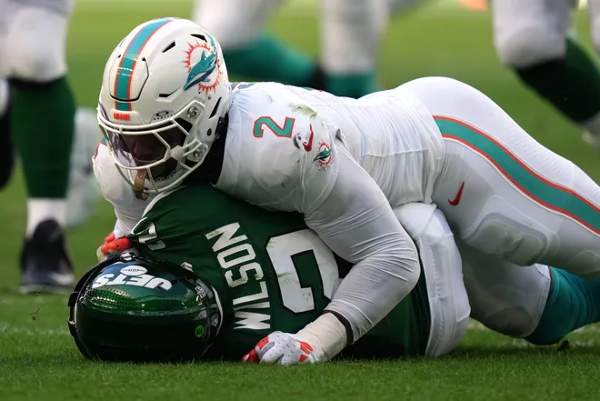 Miami Dolphins linebacker Bradley Chubb (2) sacks New York Jets quarterback Zach Wilson (2) during the first half of an NFL game at Hard Rock Stadium in Miami Gardens, Dec. 17, 2023.