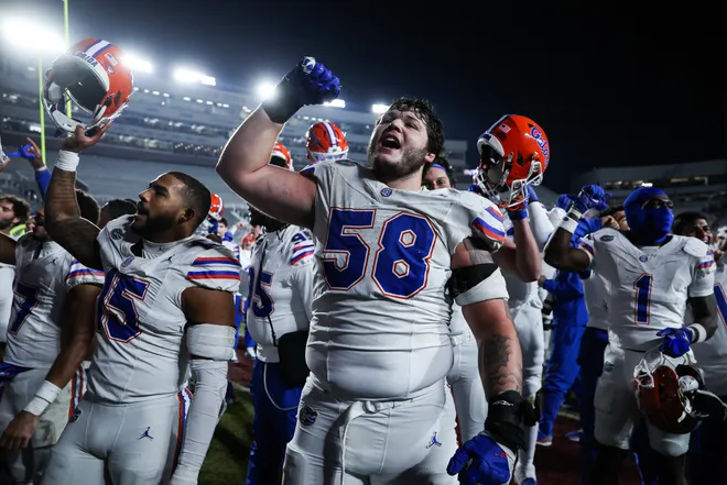TALLAHASSEE, FLORIDA - NOVEMBER 30: Austin Barber #58 of the Florida Gators celebrates after a game against the Florida State Seminoles of a game at Doak Campbell Stadium on November 30, 2024 in Tallahassee, Florida. (Photo by James Gilbert/Getty Images)