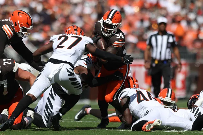 Sep 7, 2025; Cleveland, Ohio, USA; Cleveland Browns running back Jerome Ford (34) runs against Cincinnati Bengals safety Jordan Battle (27) during the second half at Huntington Bank Field. Mandatory Credit: Scott Galvin-Imagn Images
