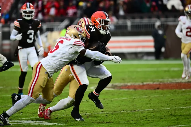 Nov 30, 2025; Cleveland, Ohio, USA; Cleveland Browns running back Jerome Ford (34) is tackled by San Francisco 49ers safety Malik Mustapha (6) during the second half at Huntington Bank Field. Mandatory Credit: Ken Blaze-Imagn Images