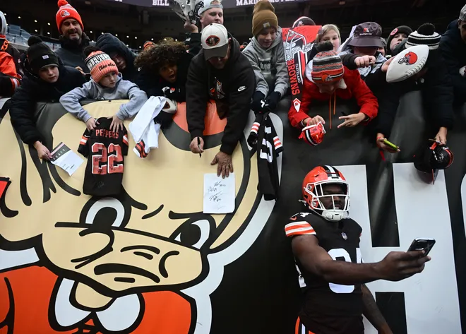 Nov 16, 2025; Cleveland, Ohio, USA; Cleveland Browns running back Jerome Ford (34) takes a selfie with fans prior to a game against the Baltimore Ravens at Huntington Bank Field. Mandatory Credit: Ken Blaze-Imagn Images