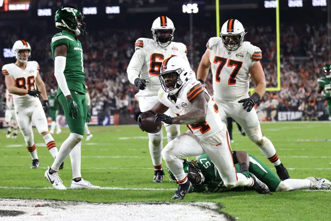 Dec 28, 2023; Cleveland, Ohio, USA; Cleveland Browns running back Jerome Ford (34) scores a touchdown during the first half against the New York Jets at Cleveland Browns Stadium. Mandatory Credit: Scott Galvin-USA TODAY Sports