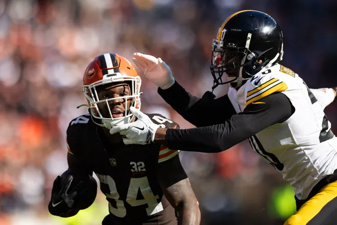 Nov 19, 2023; Cleveland, Ohio, USA; Pittsburgh Steelers cornerback Patrick Peterson (20) grabs the face mask of Cleveland Browns running back Jerome Ford (34) as he tackles him during the first quarter at Cleveland Browns Stadium. Mandatory Credit: Scott Galvin-USA TODAY Sports