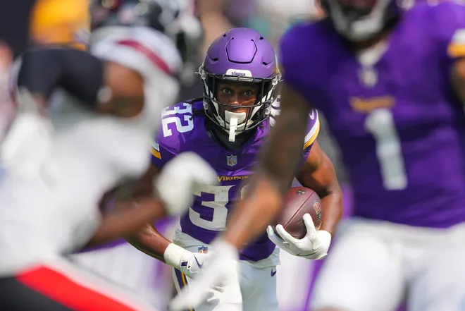 Aug 9, 2025; Minneapolis, Minnesota, USA; Minnesota Vikings running back Ty Chandler (32) runs with the ball against the Houston Texans in the second quarter at U.S. Bank Stadium. Mandatory Credit: Brad Rempel-Imagn Images