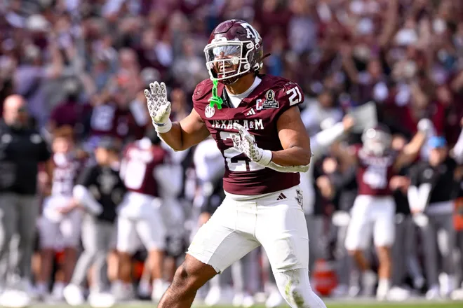 Dec 20, 2025; College Station, TX, USA; Texas A&M Aggies linebacker Taurean York (21) celebrates during the game between the Aggies and the Hurricanes at Kyle Field. Mandatory Credit: Jerome Miron-Imagn Images