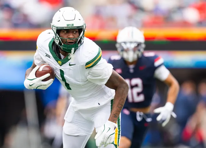 Nov 22, 2025; Tucson, Arizona, USA; Baylor Bears tight end Michael Trigg (1) against the Arizona Wildcats at Casino Del Sol Stadium. Mandatory Credit: Mark J. Rebilas-Imagn Images
