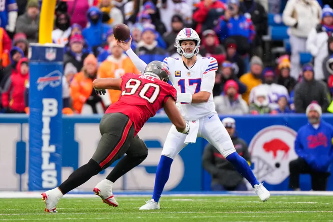 Nov 16, 2025; Orchard Park, New York, USA; Buffalo Bills quarterback Josh Allen (17) passes against Tampa Bay Buccaneers defensive end Logan Hall (90) during the first half of the game at Highmark Stadium. Mandatory Credit: Gregory Fisher-Imagn Images